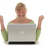 happy woman using laptop